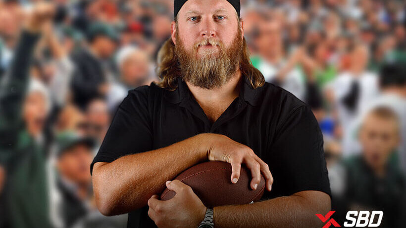Nick Mangold holding football