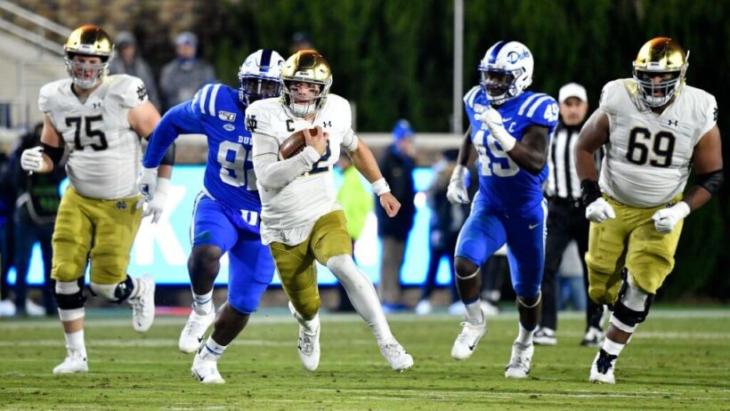 Notre Dame QB Ian Book runs the ball