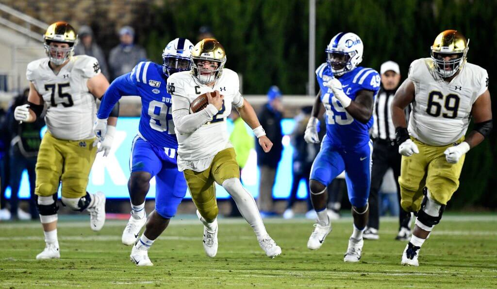Notre Dame QB Ian Book runs the ball