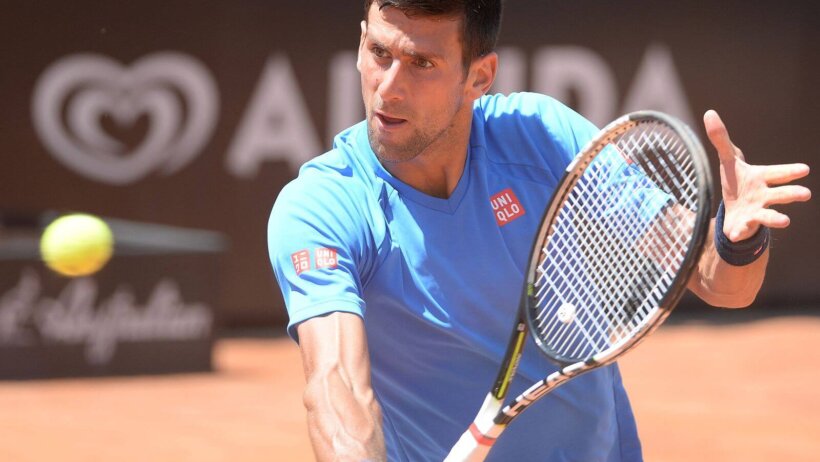 Novak Djokovic hitting a volley