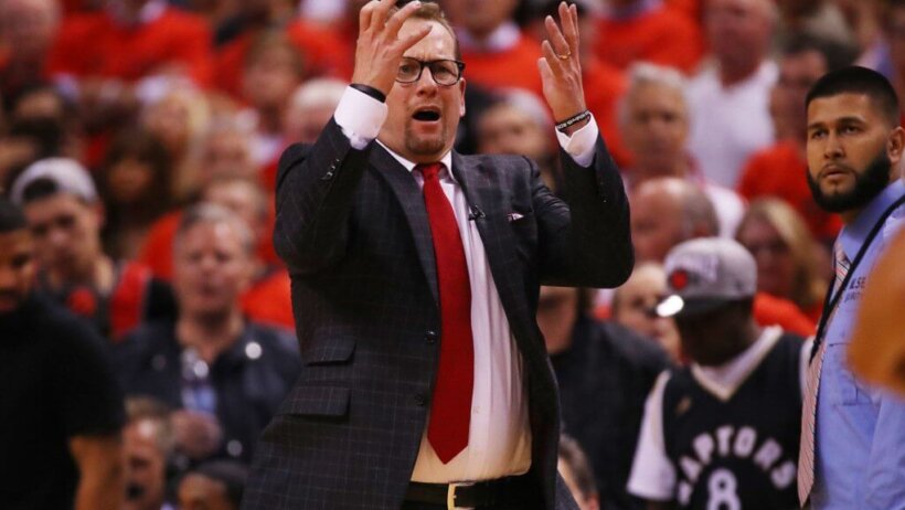 Nick Nurse with his hands in the air