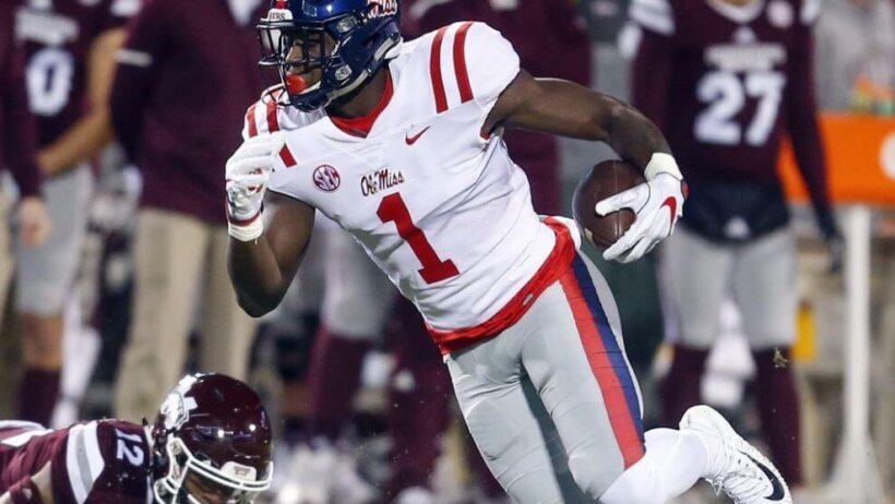 Ole Miss wideout DK Metcalf eludes a Mississippi State defender.