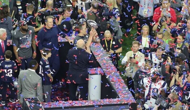 Tom Brady raising the Lombardi Trophy after Super Bowl 51