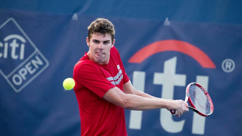 Reilly Opelka hitting a backhand
