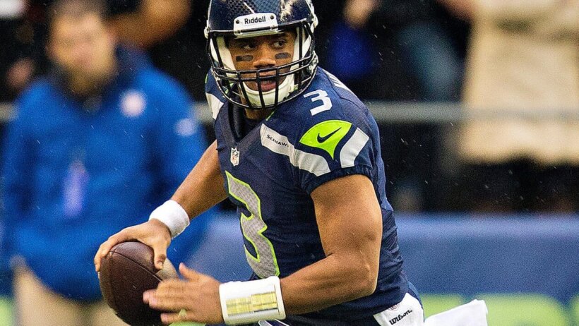 Russell Wilson running and looking to pass