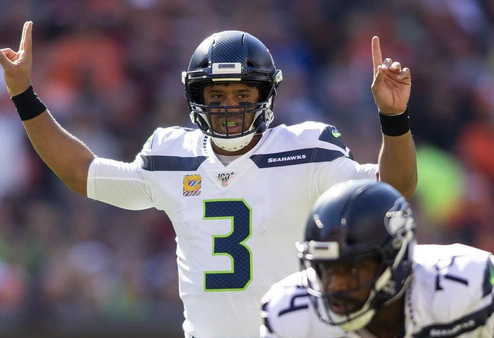 Russell Wilson signaling at the line of scrimmage