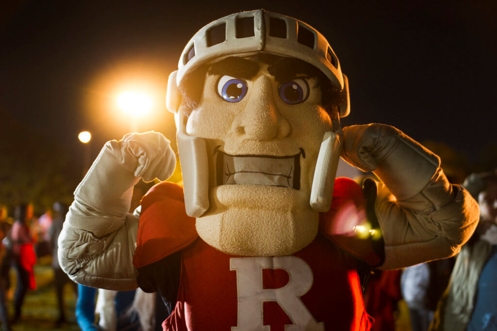 The Rutgers football mascot flexing.