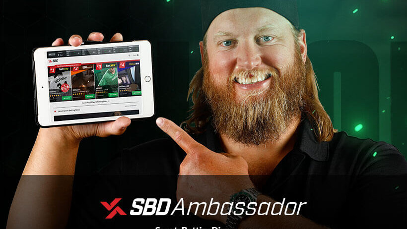SBD's new ambassador, Nick Mangold holding a tablet and pointing to a preview