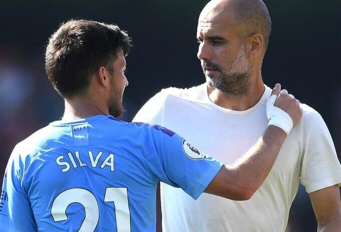 David Silva (left) and Pep Guardiola get up-close for Manchester City