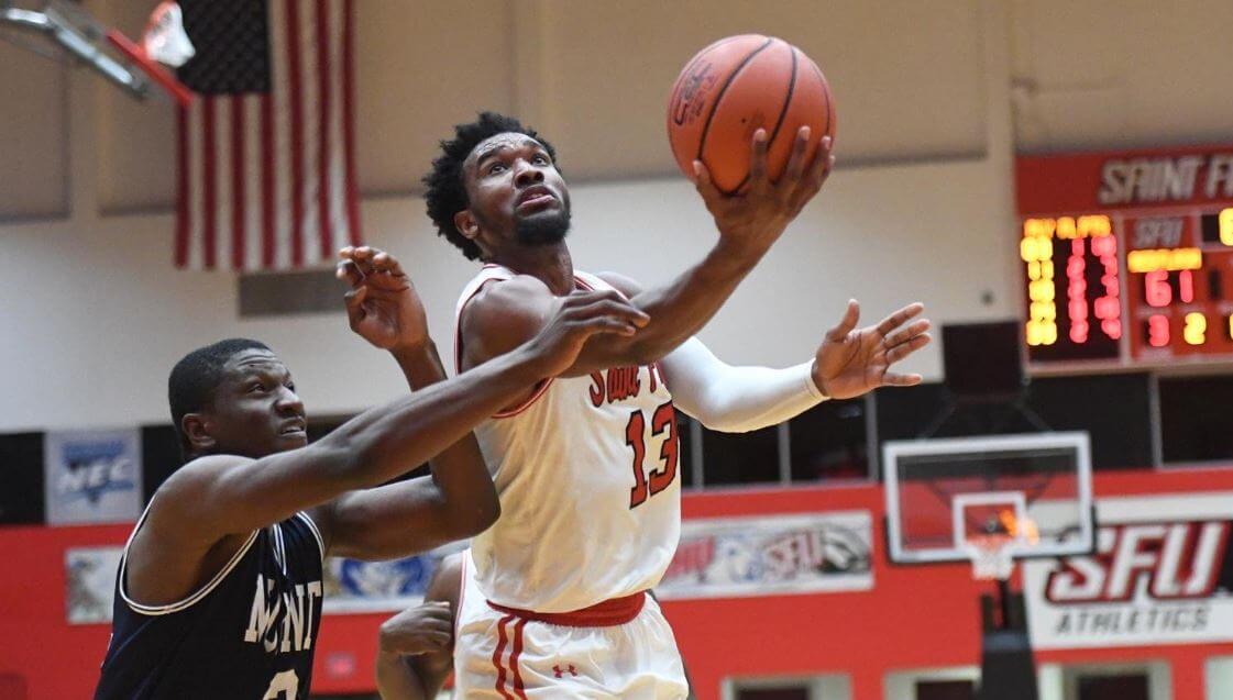 St Francis PA guard Keith Braxton laying the ball in the hoop.