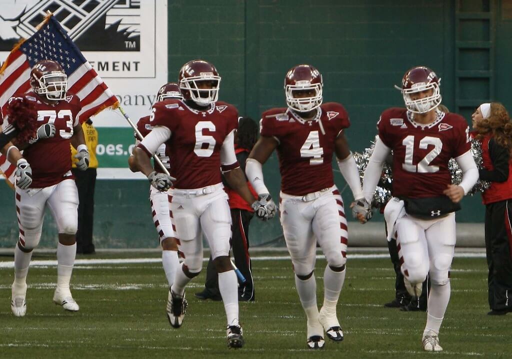 The Temple Owls Football team takes the field