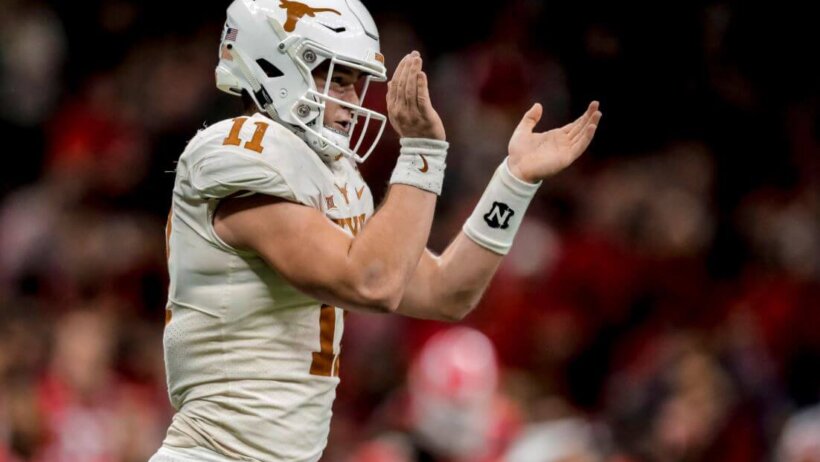 Texas QB Sam Ehlinger clapping.