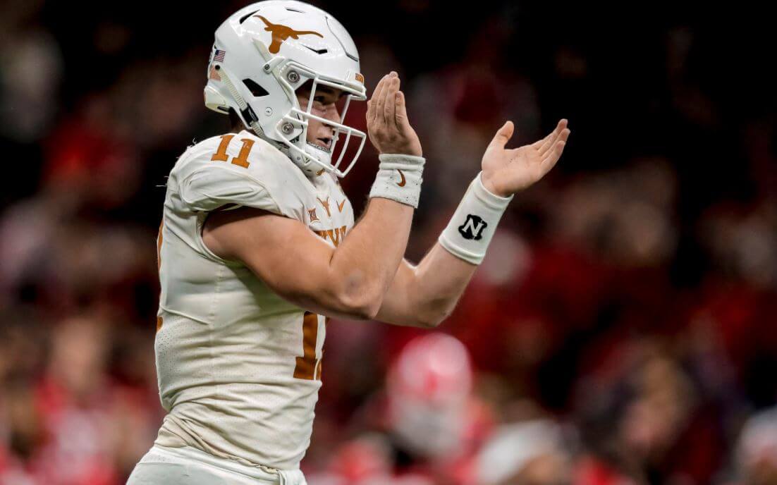 Texas QB Sam Ehlinger clapping.