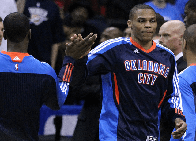 OKC Thunder guard Russell Westbrook giving a teammate a high-five