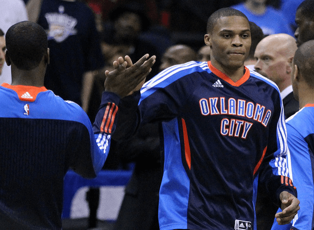 OKC Thunder guard Russell Westbrook giving a teammate a high-five