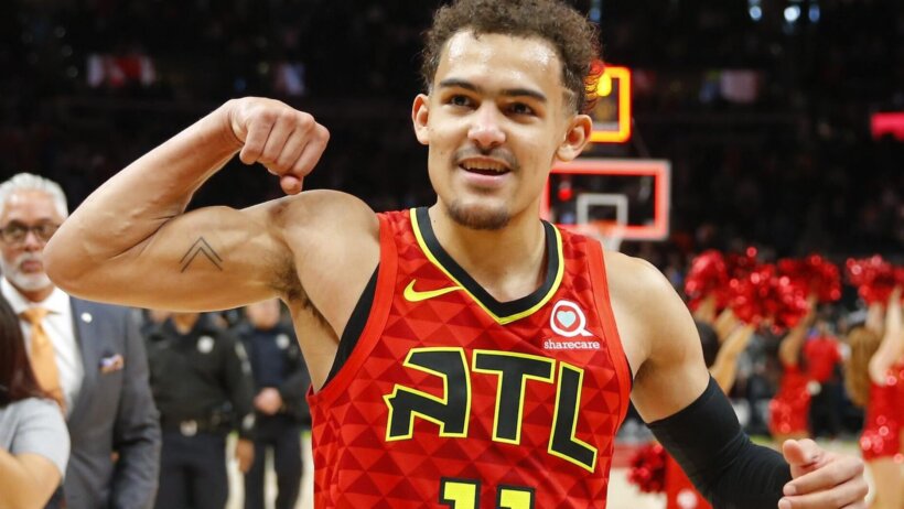 Trae Young flexing