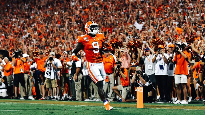Clemson RB Travis Etienne runs the ball against Georgia Tech