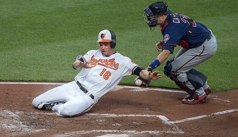 Trey Mancini slides into home.
