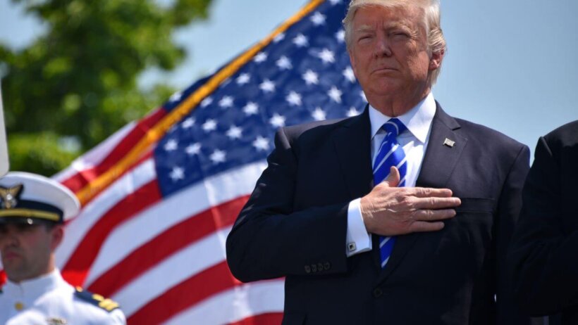 Donald Trump, hand on heart.