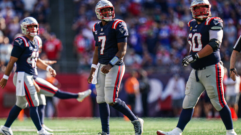 New England Patriots quarterback Jacoby Brissett walking off the field