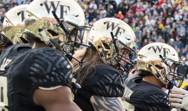 Players from Wake Forest and Temple shake hands before the Coin Toss during the 2016 Military Bowl