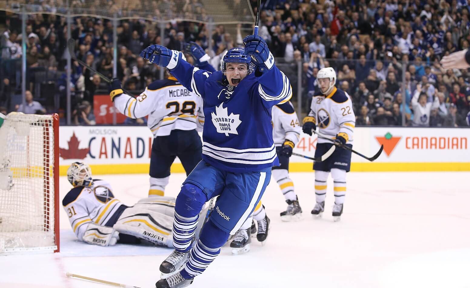 Zach Hyman of the Toronto Maple Leafs scoring on the Bruins.