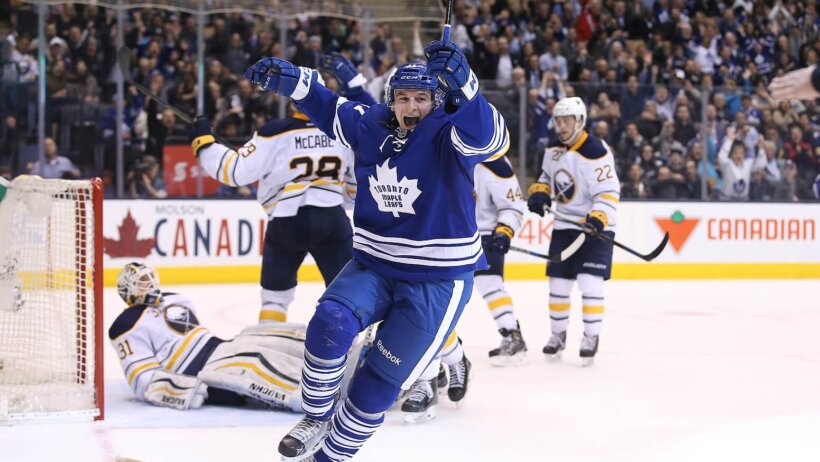 Zach Hyman of the Toronto Maple Leafs scoring on the Bruins.