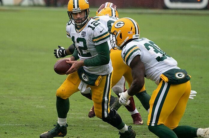 Aaron Rodgers handing the ball off.