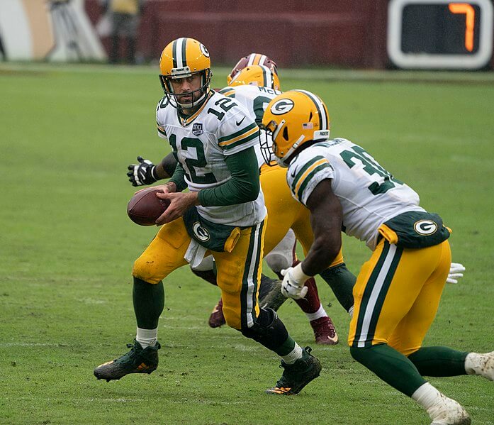 Aaron Rodgers handing the ball off.