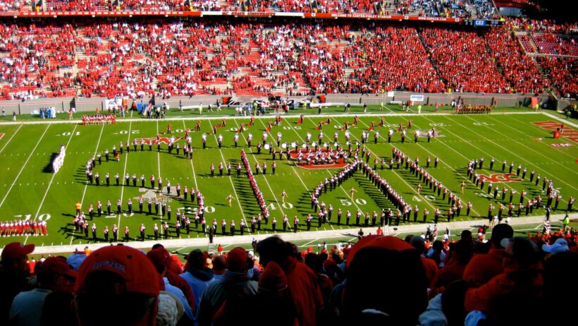 Wide shot of NC State marching band on the field