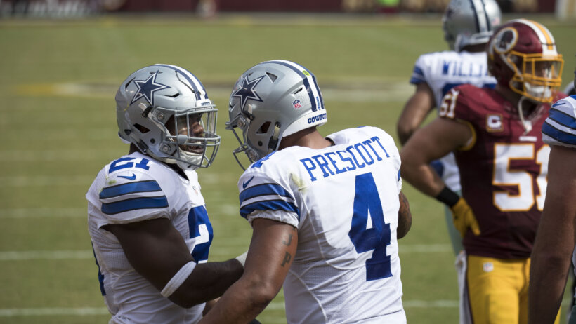 Ezekiel Elliott and Dak Prescott discuss a play
