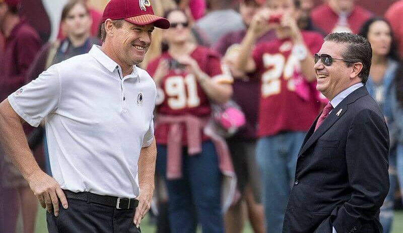 Washington Redskins owner Daniel Snyder smiling on sidelines.