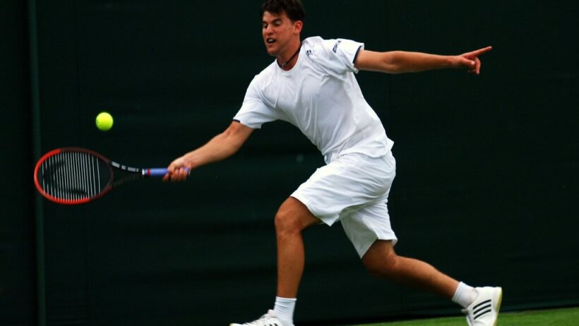 Dominic Thiem returns a shot
