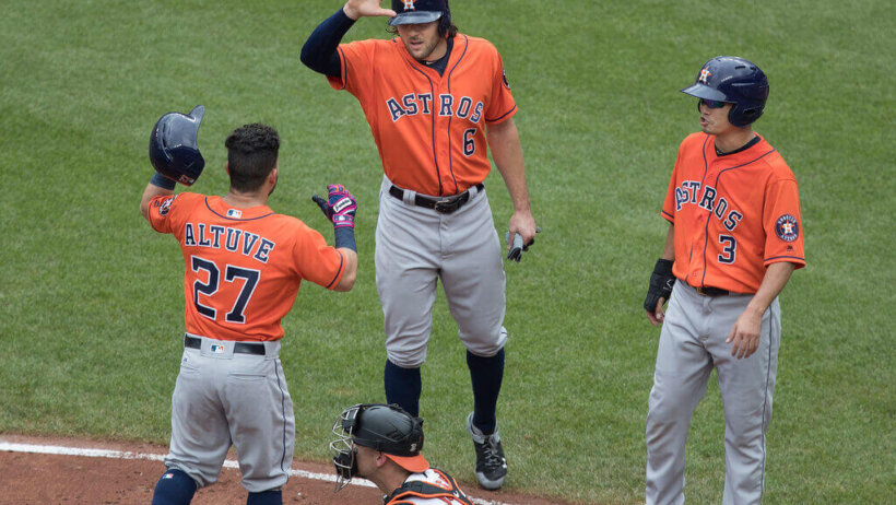 Houston Astros celebrate at home plate.