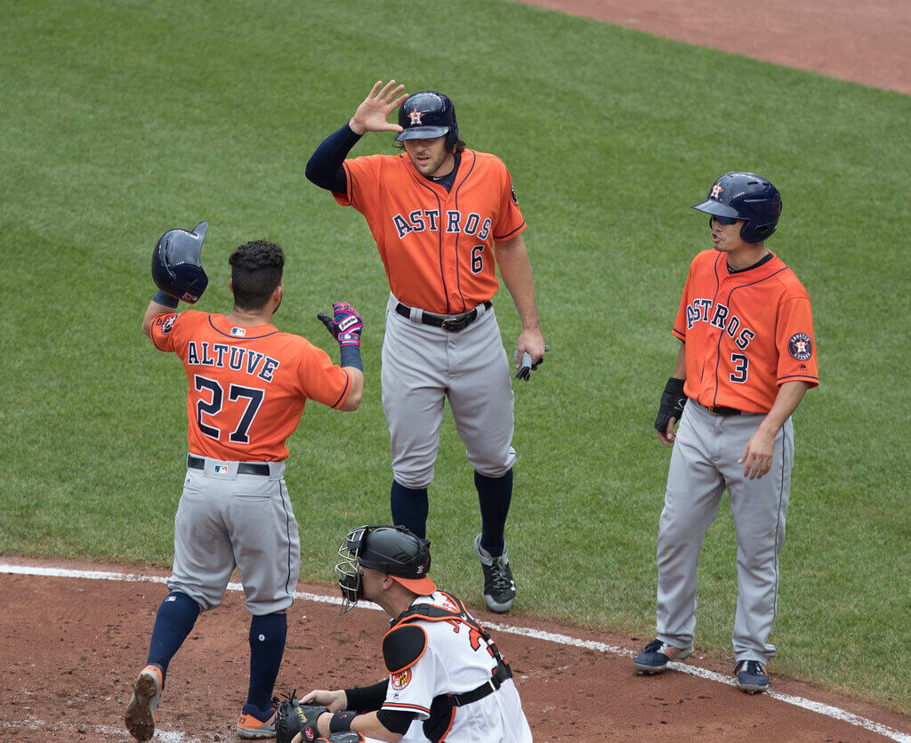 Houston Astros high fiving at home plate