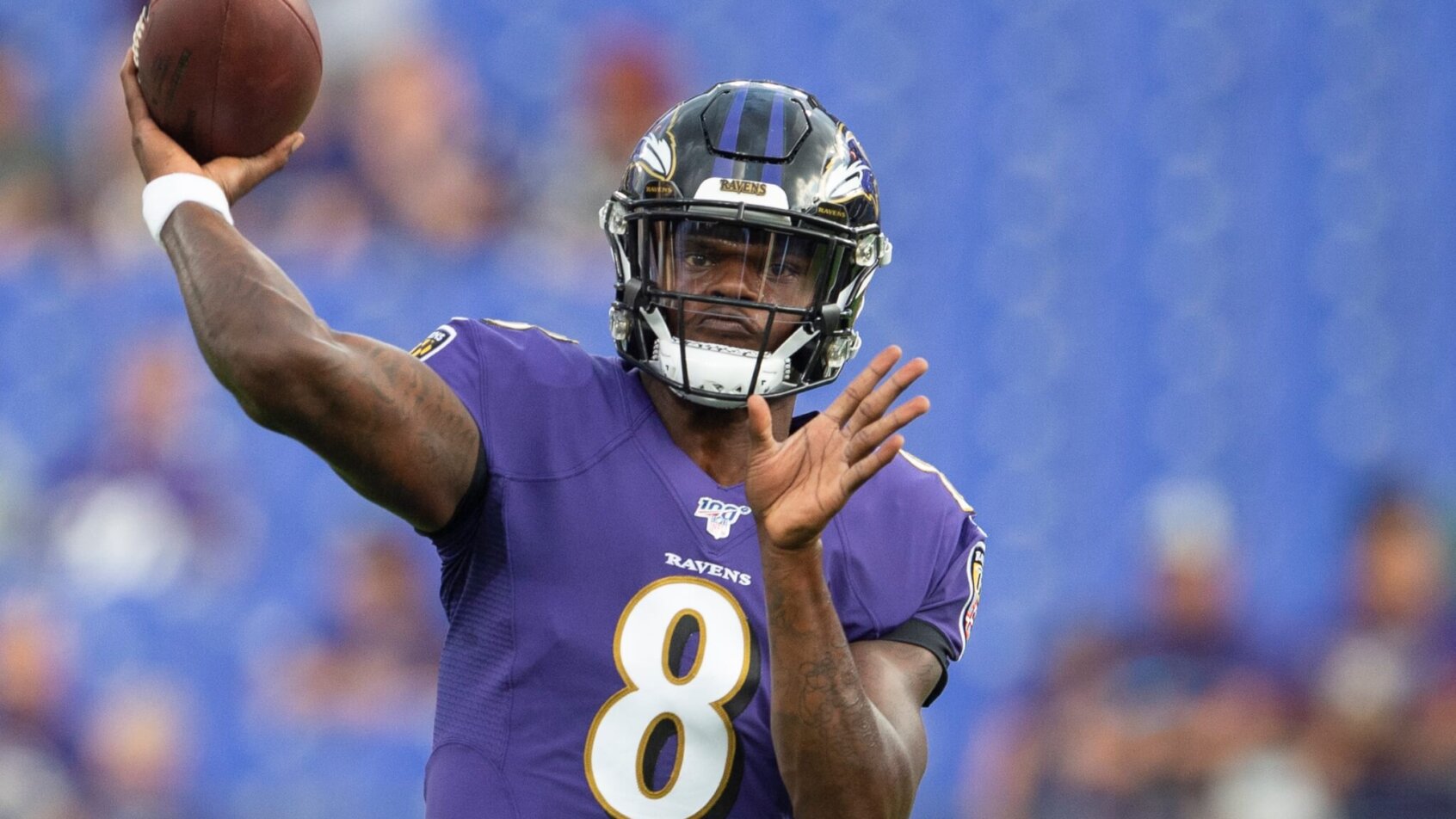 Lamar Jackson throwing a pass