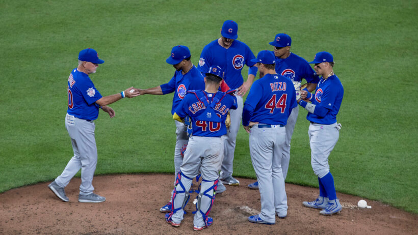 Cubs players celebrating on the mound