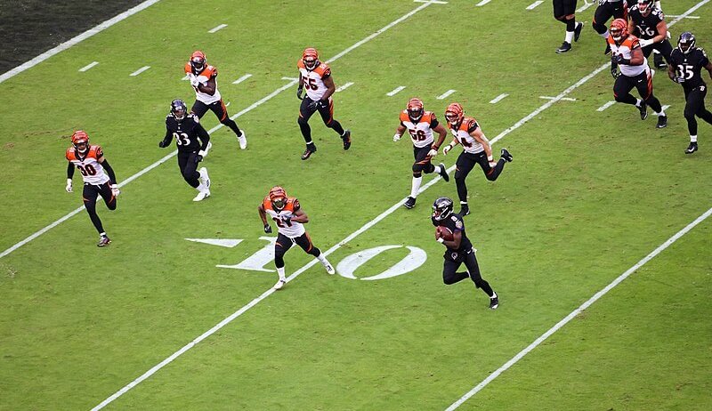Lamar Jackson running towards the end zone.