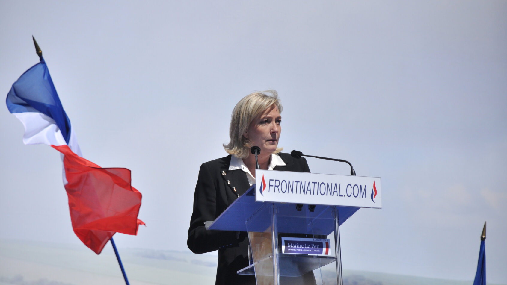 Le Pen speaks at the podium