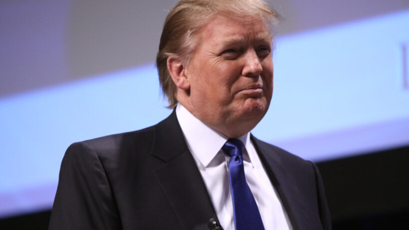 Donald Trump frowning on stage