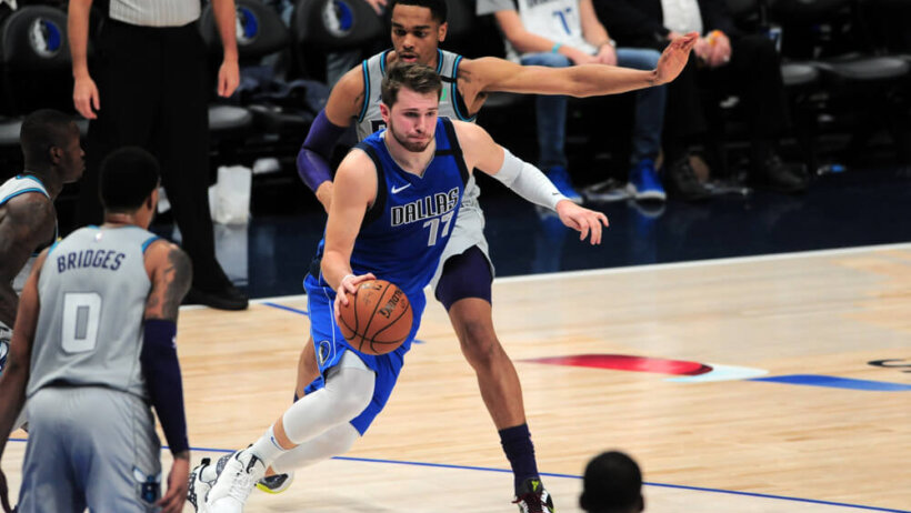 Luka Doncic dribbling by defender