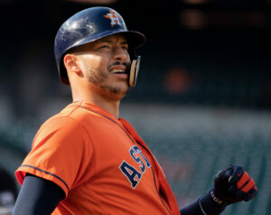 Carlos Correa watching fight of baseball he just hit