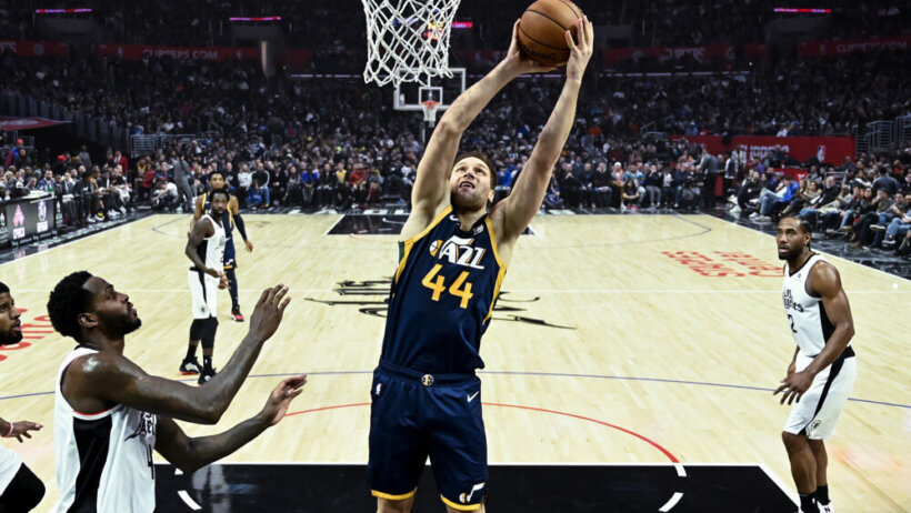 Utah Jazz's Bojan Bogdanovic shooting under the net during a basketball game.
