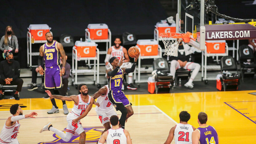 Los Angeles Lakers player Dennis Schroder going up for a layup during a NBA game versus the Chicago Bulls.