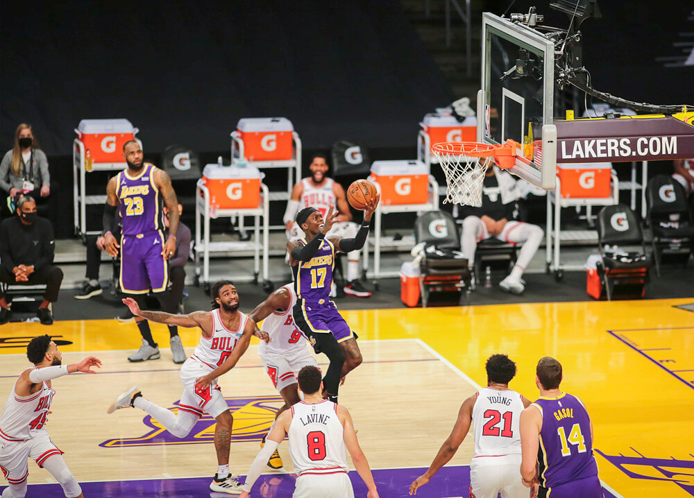 Los Angeles Lakers player Dennis Schroder going up for a layup during a NBA game versus the Chicago Bulls.