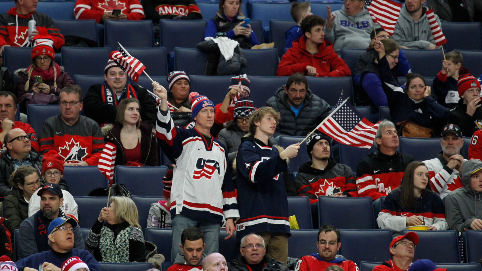 USA fans celebrating in the stands at a World Junior game.