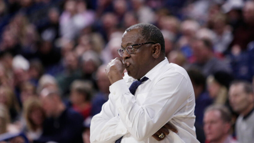Rod Barnes arms crossed standing on the sideline