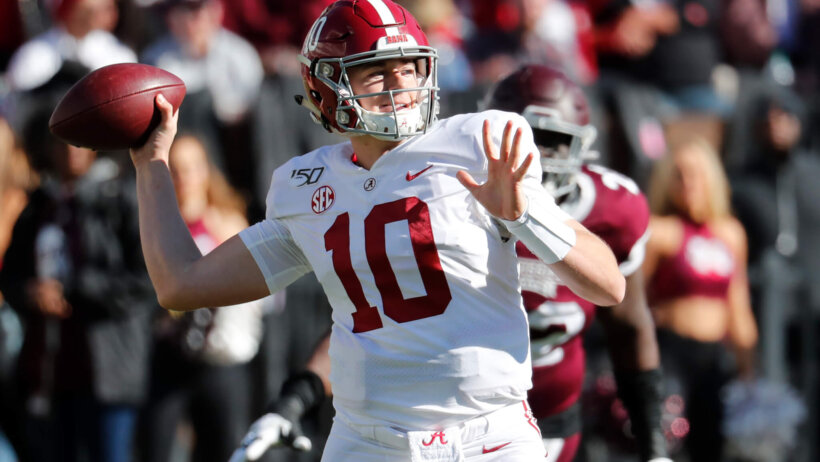 Mac Jones throwing a pass