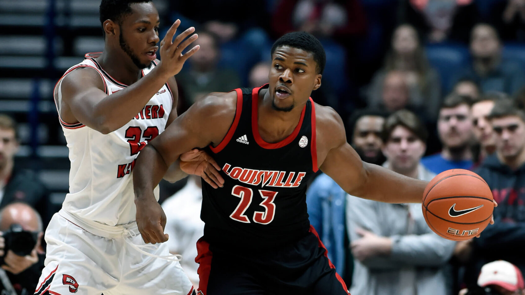 Charles Bassey defending a player in the low post