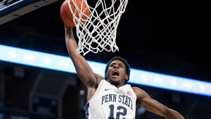 Izaiah Brockington dunking the basketball